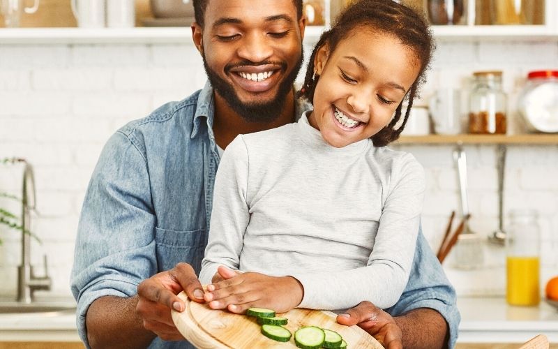Teaching kids to cook (vegan) - Father and daughter cooking together