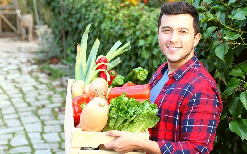 Man with vegetable box Are CSA boxes worth it?